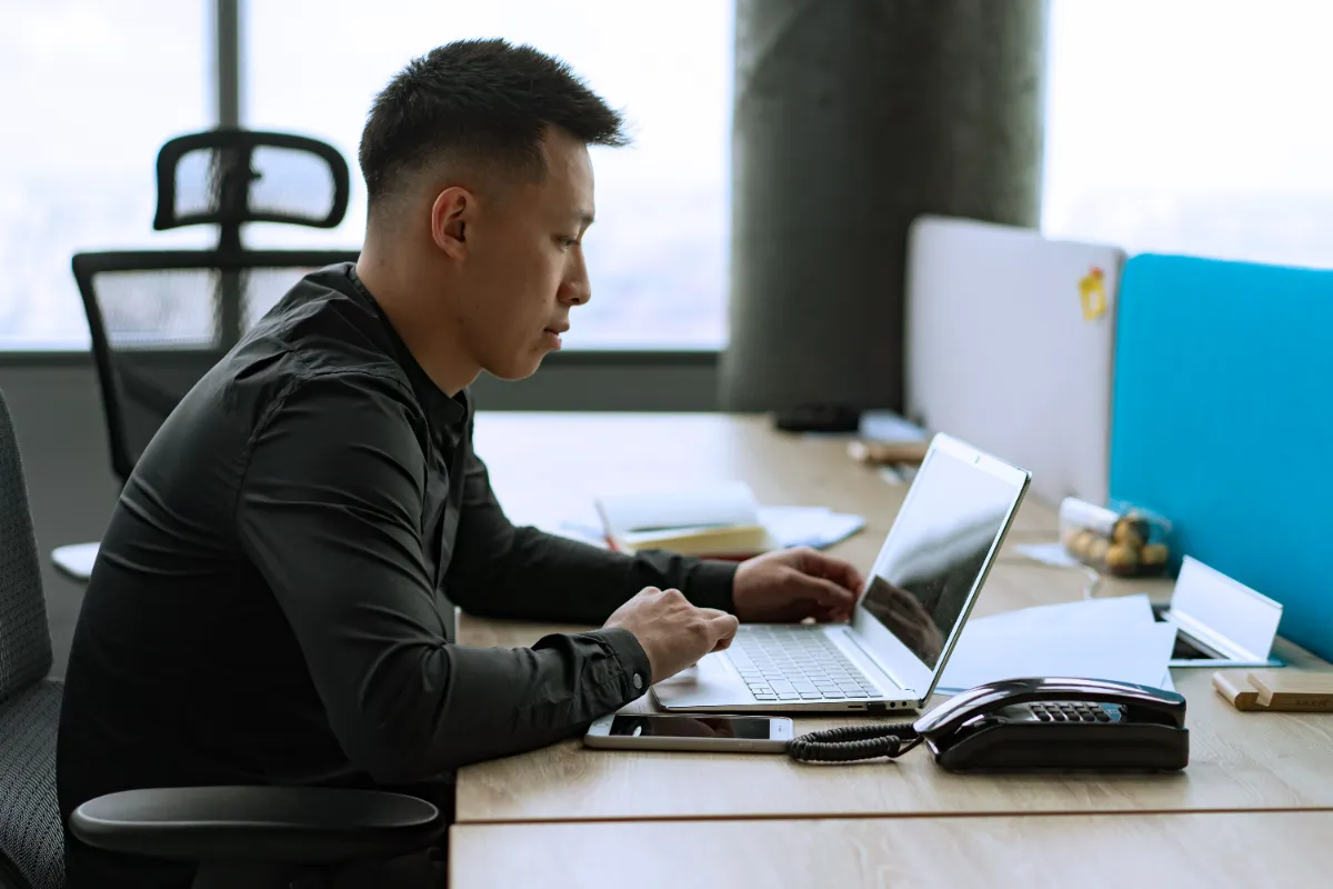Someone checking account security on a laptop at home